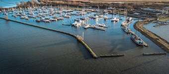 Luxury apartment with private terrace, spacious living room, and stunning views of the marina.