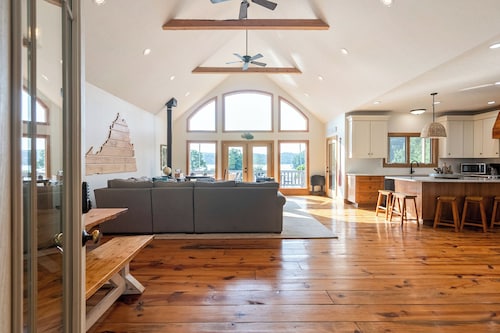 Experience the perfect blend of rustic charm and modern luxury in this Claytor lakefront retreat