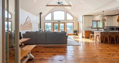 Experience the perfect blend of rustic charm and modern luxury in this Claytor lakefront retreat