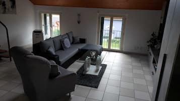 Apartamento luxo | Área de estar | TV de tela plana