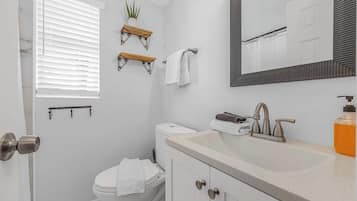 Shower, hair dryer, towels, shampoo