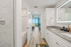Shower, hair dryer, towels, shampoo