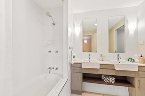 Shower, hair dryer, towels, shampoo