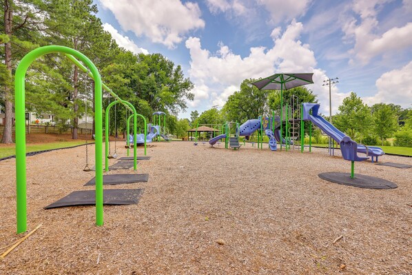 A playground with swings, slides, and climbing structures.