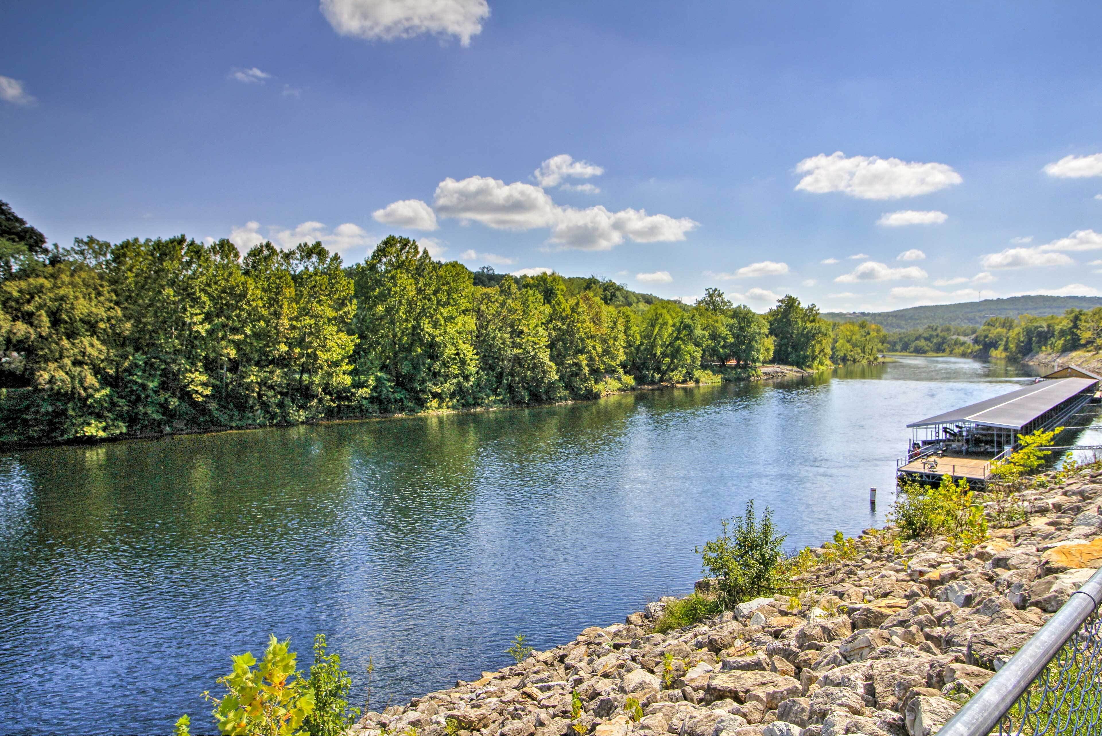 A river with a dock and a building on the right.