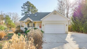 A single-story house with a garage, a covered porch, and a well-maintained lawn. - 8 Mi to Beach: Ocean Pines Home Near Marina & Golf (Berlin)