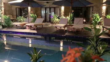 Outdoor pool, pool loungers, lifeguards on site