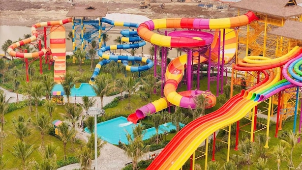 A water park with multiple slides and pools. - SURIHOME- Vinhomes Grand Park Apartments (Ho Chi Minh City)