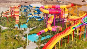 A water park with multiple slides and pools. - SURIHOME- Vinhomes Grand Park Apartments (Ho Chi Minh City)