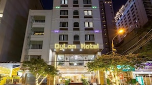 A multi-story hotel with a prominent 'Dylan Hotel' sign at the top. - Dung Nam Hotel (Da Nang)