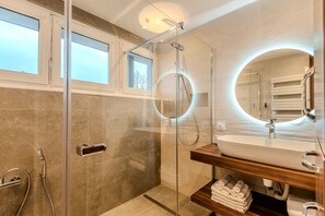 Shower, hair dryer, towels, soap