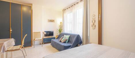 Basic Condo | Living area | 25-inch flat-screen TV with satellite channels