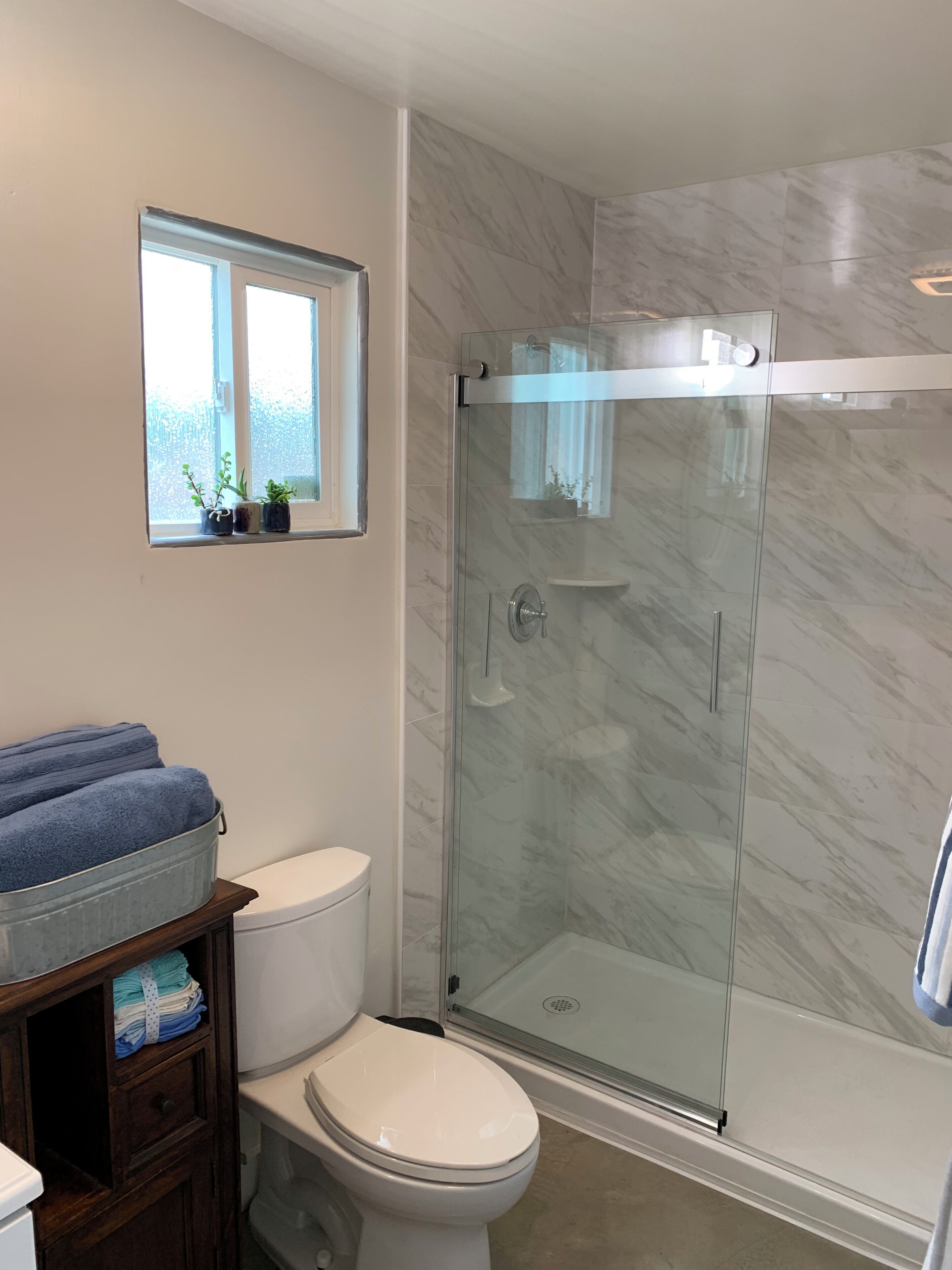 Shower, hair dryer, towels, soap