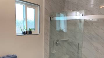 Shower, hair dryer, towels, soap