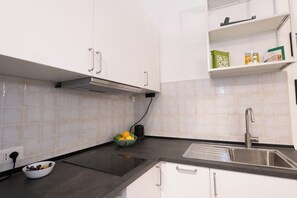 Fridge, microwave, stovetop, coffee/tea maker