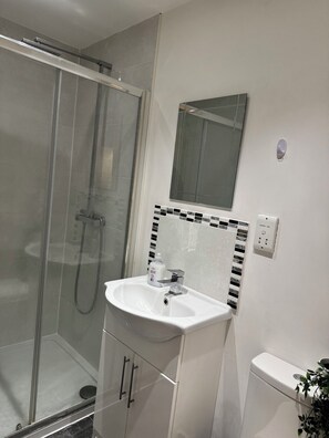 Shower, hair dryer, towels, soap