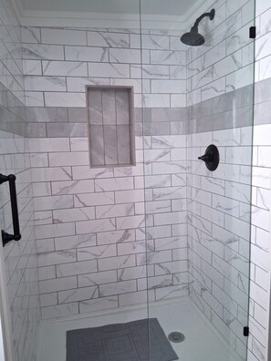 Shower, hair dryer, towels, toilet paper