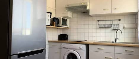 Fridge, coffee/tea maker, cookware/dishes/utensils