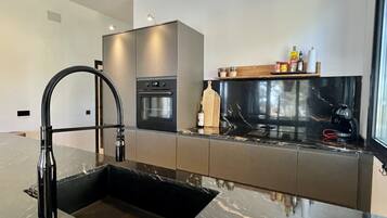 Villa | Private kitchen | Fridge, microwave, oven, dishwasher