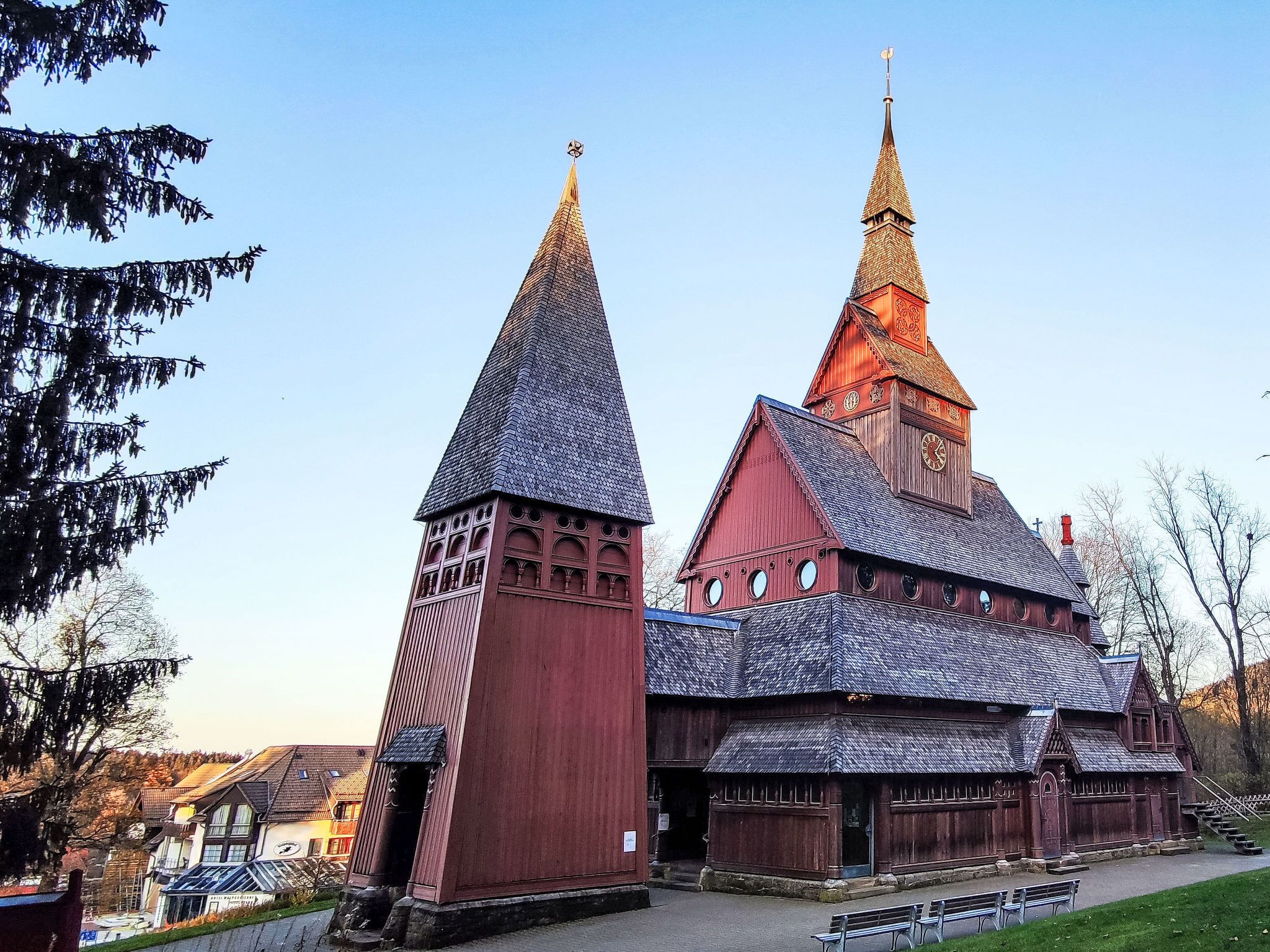 A historic building with a prominent tower and a smaller adjacent structure.