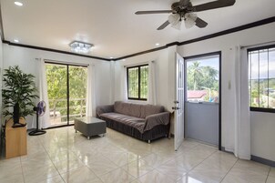 Family Double Room | Living area | 28-inch flat-screen TV with satellite channels