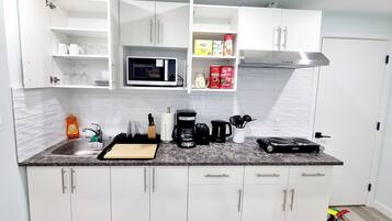 Fridge, microwave, stovetop, coffee/tea maker