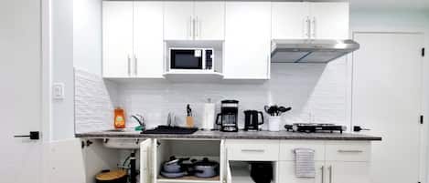 Fridge, microwave, stovetop, coffee/tea maker