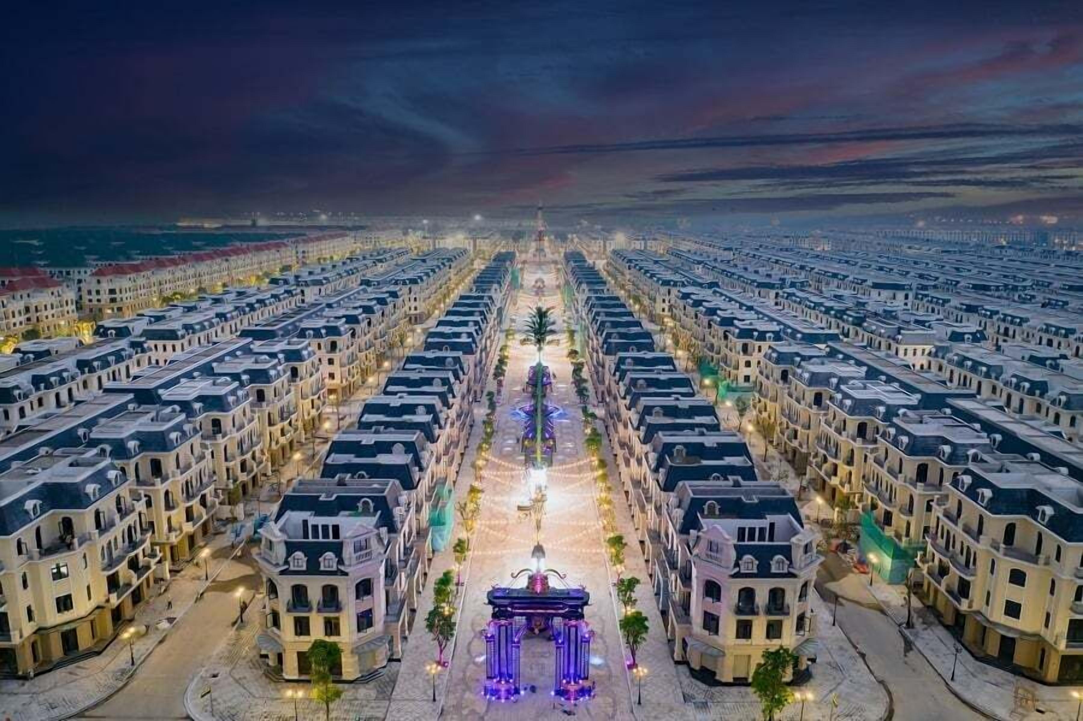 A symmetrical hotel layout with a central walkway and uniform building facades.