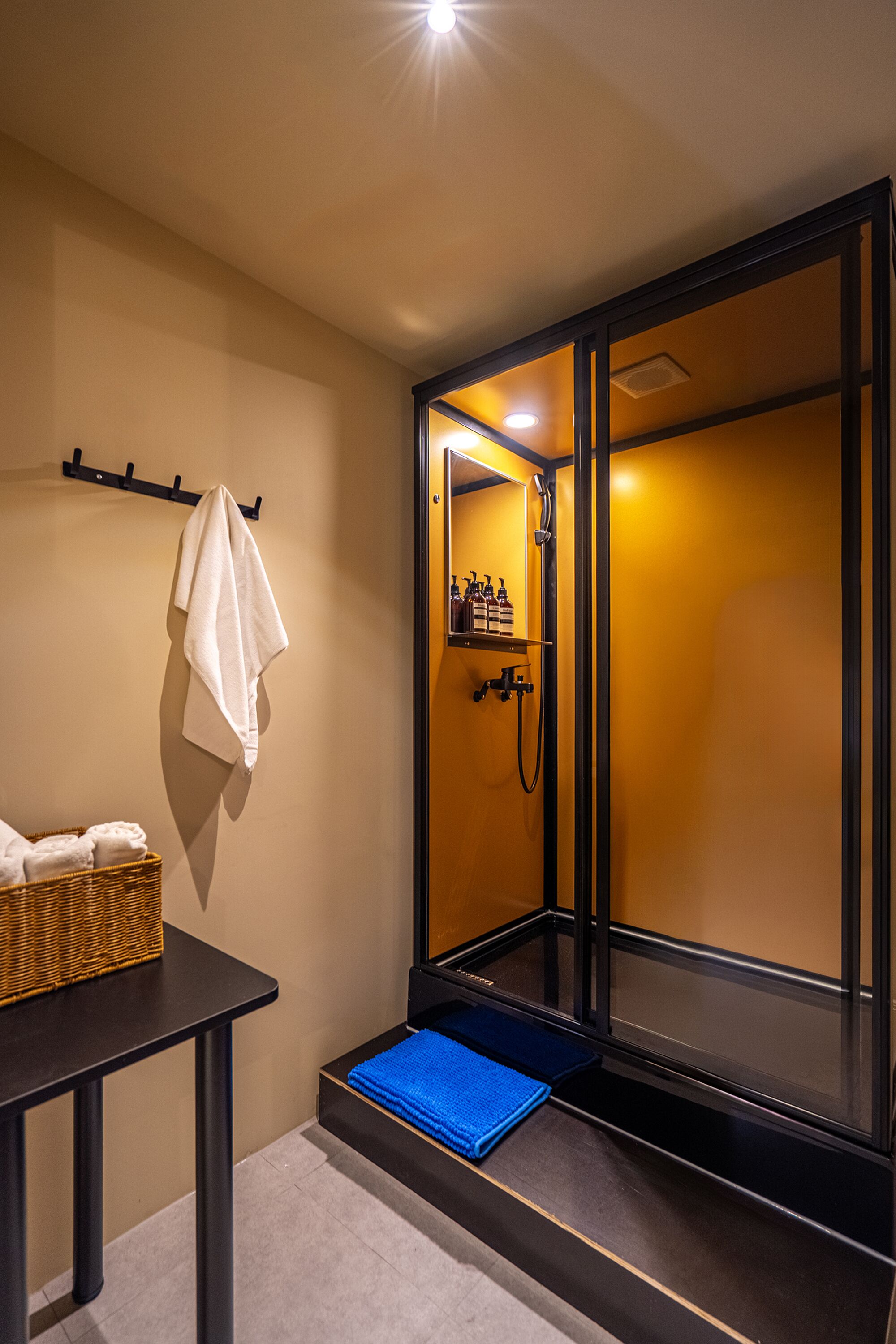 Economy Cabin | Bathroom | Shower, hair dryer, slippers, towels