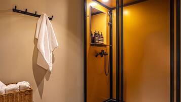 Economy Cabin | Bathroom | Shower, hair dryer, slippers, towels