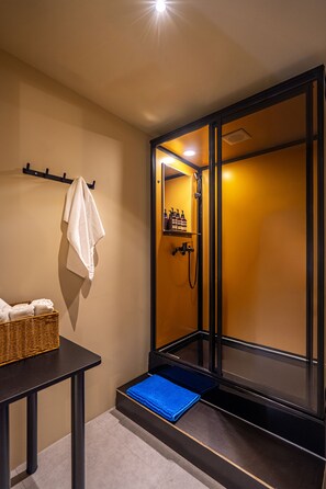 Economy Cabin | Bathroom | Shower, hair dryer, slippers, towels