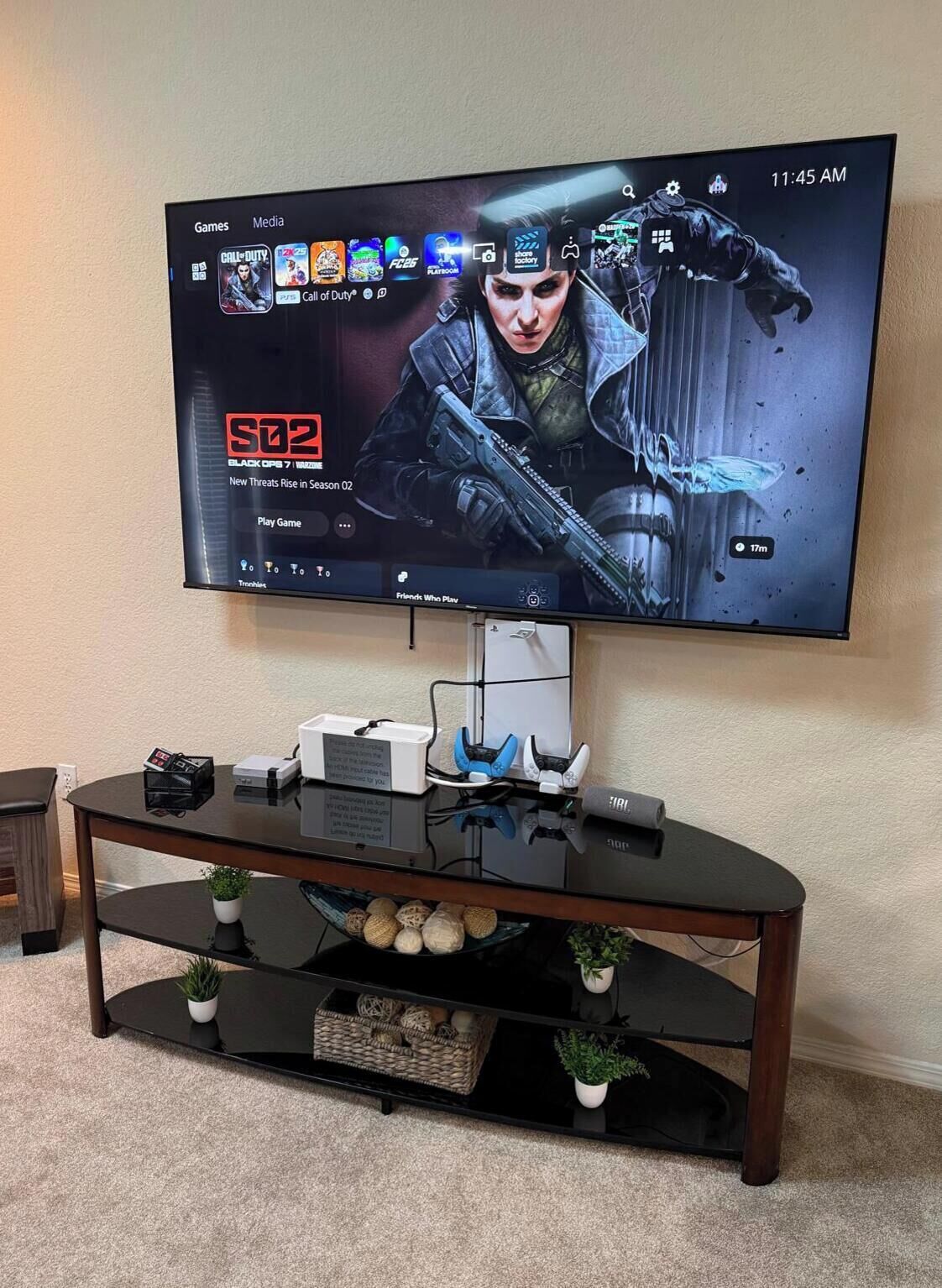 A television mounted on a wall displaying a game interface.