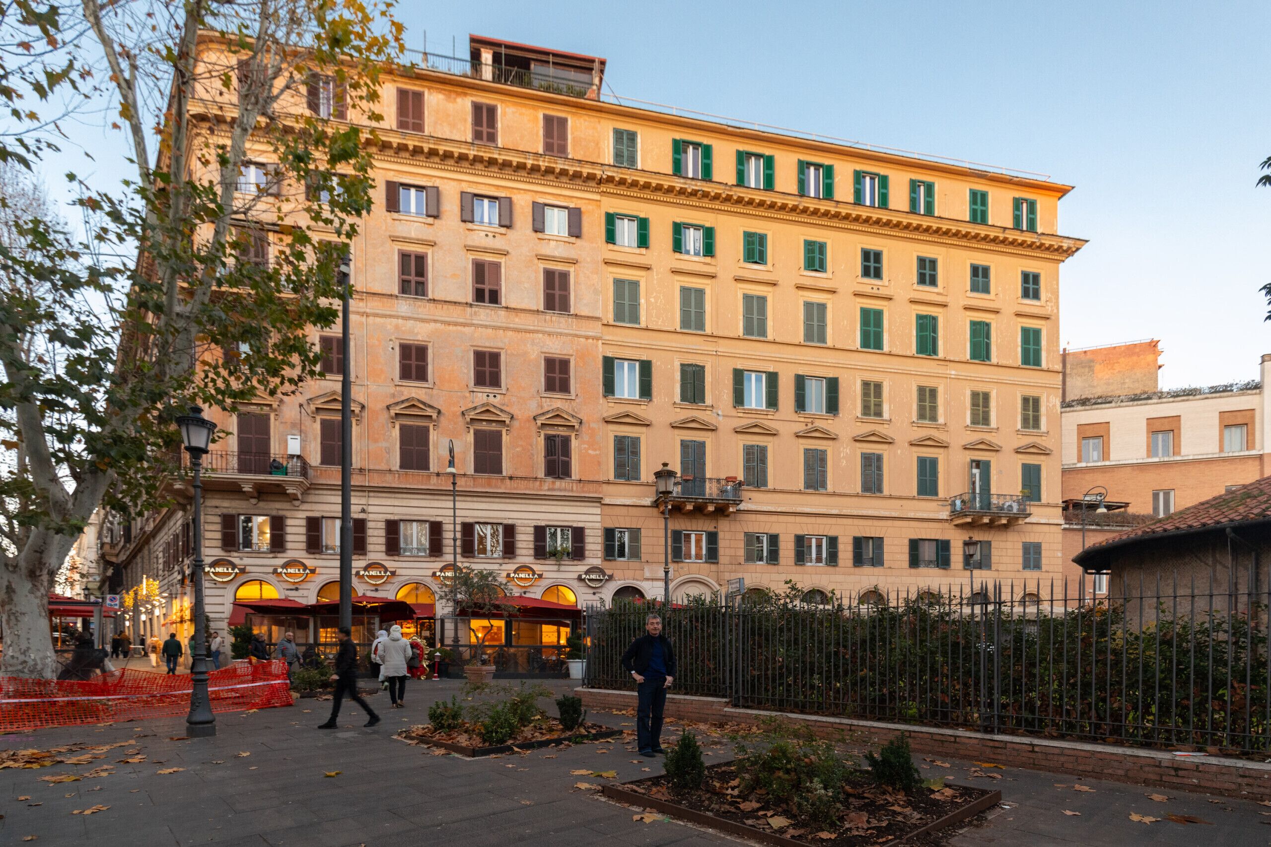 A multi-story building with a classic architectural style, featuring a series of windows and balconies.