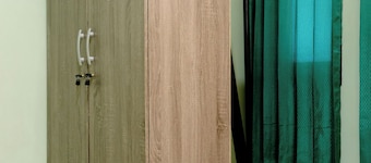 Tempat istirahat nyaman berada di perkampungan, 14 menit ke Botanical Garden