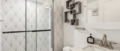 Shower, hair dryer, towels, shampoo