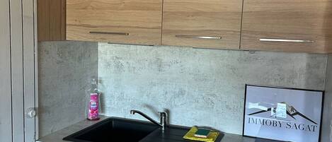 Fridge, microwave, stovetop, coffee/tea maker