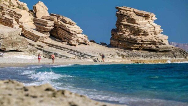 A coastal landscape with layered rock formations and clear blue waters. - Melina Dream House Retreat at Akoumia (Agios Vasileios)