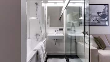 Shower, hair dryer, towels, shampoo