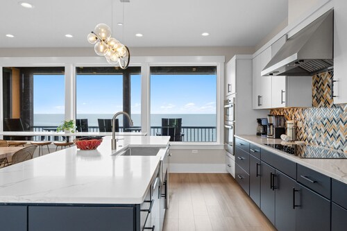 Experience luxury at the Black Pearl, an oceanfront home in Oak Island with 11 bedrooms.