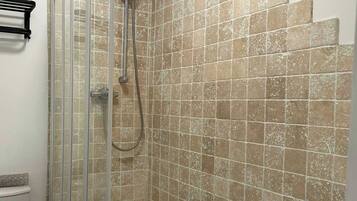 Shower, hair dryer, shampoo