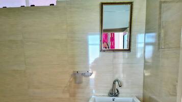 Shower, towels, soap, toilet paper
