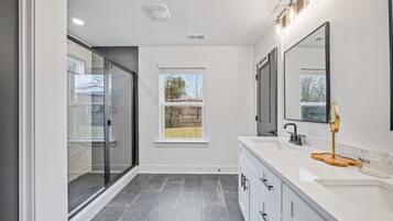 Shower, hair dryer, towels, soap