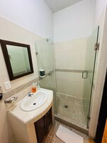 Standard Room, 1 King Bed | Bathroom | Shower, rainfall showerhead, free toiletries, towels