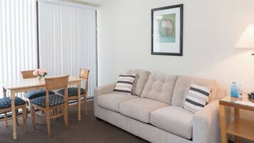 Suite, 1 Bedroom | Living area | TV