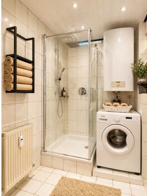 Shower, hair dryer, towels, soap
