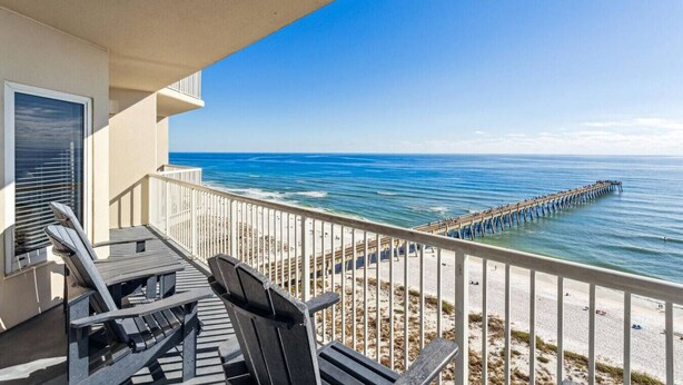 A balcony with a view of the ocean and a pier extending into the water. - Fiddler on The Reef, Navarre Beach FL (Navarre)