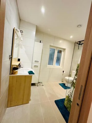 Shower, hair dryer, towels, soap