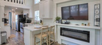 Nesthaven: A cozy boho-chic tiny home with a deck, fire pit, & nearby waterfall