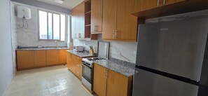 Private kitchen - Charming 2-bedroom apt in Addis Ababa, a short walk from the African Union HQ. (Addis Ababa)