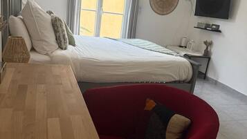 1 bedroom, desk, iron/ironing board, travel crib